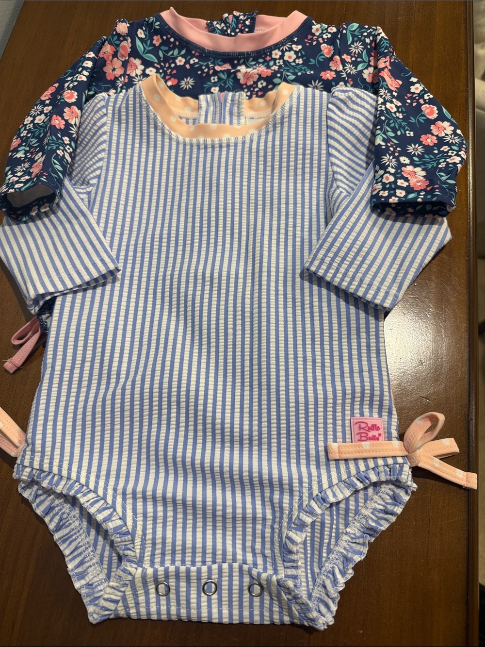Set of Two Ruffle Butts Long Sleece Swimsuits in Blue and Pink